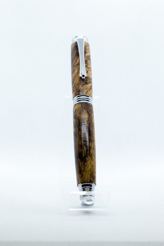 Wooden pen with silver accents on a white background