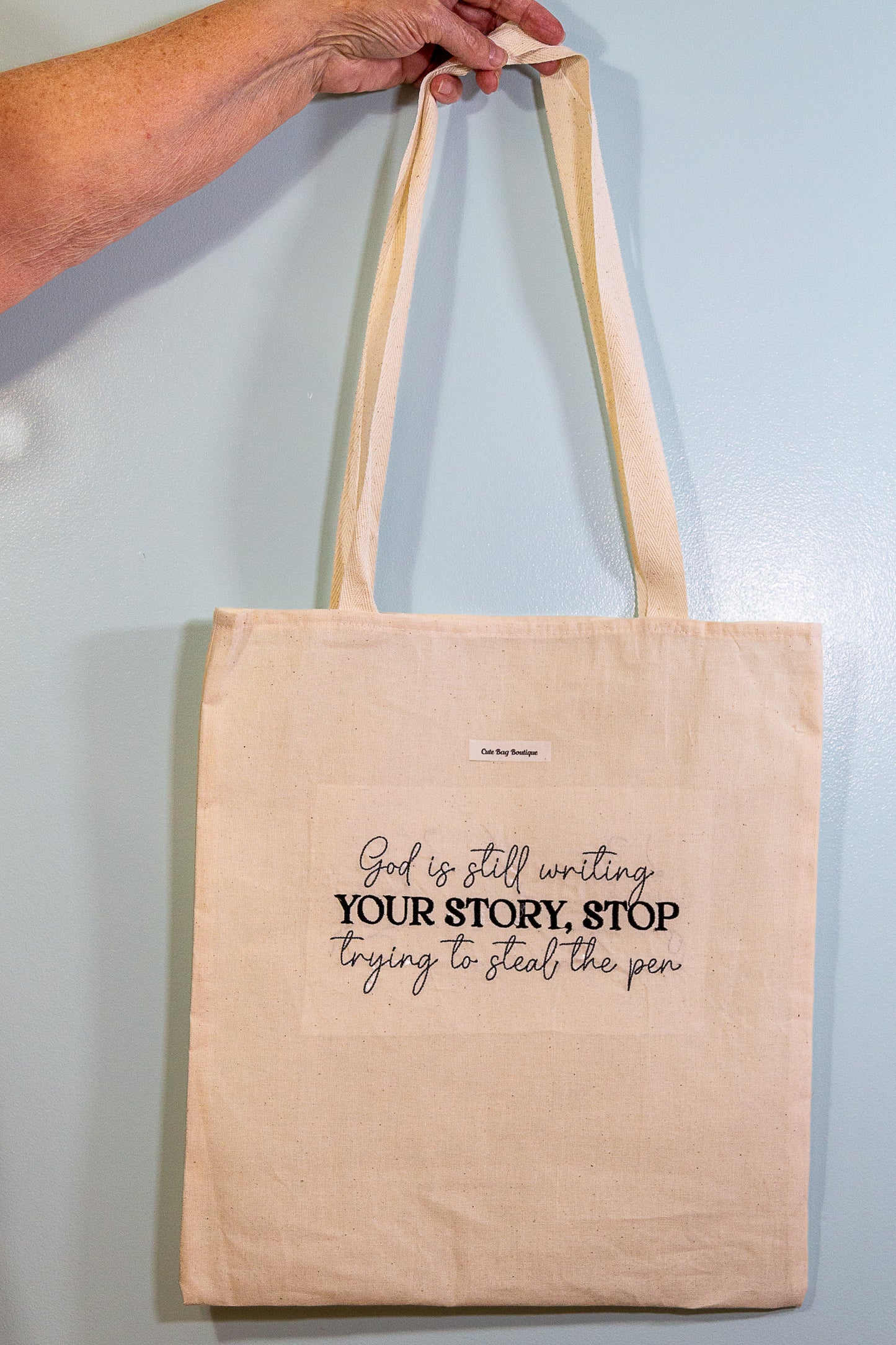 Embroidered God is Still Writing Tote Bag